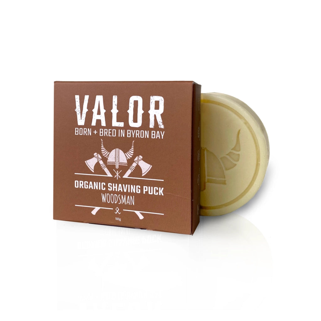 Valor Organic Woodsman Cedarwood Lemon Soap shaving puck with packaging on a white background

